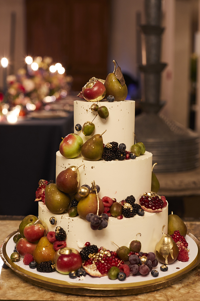 A colorful wedding cake with fruit